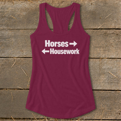 Maroon women's racerback tank top featuring the white text "Horses" pointing right and "Housework" pointing left.