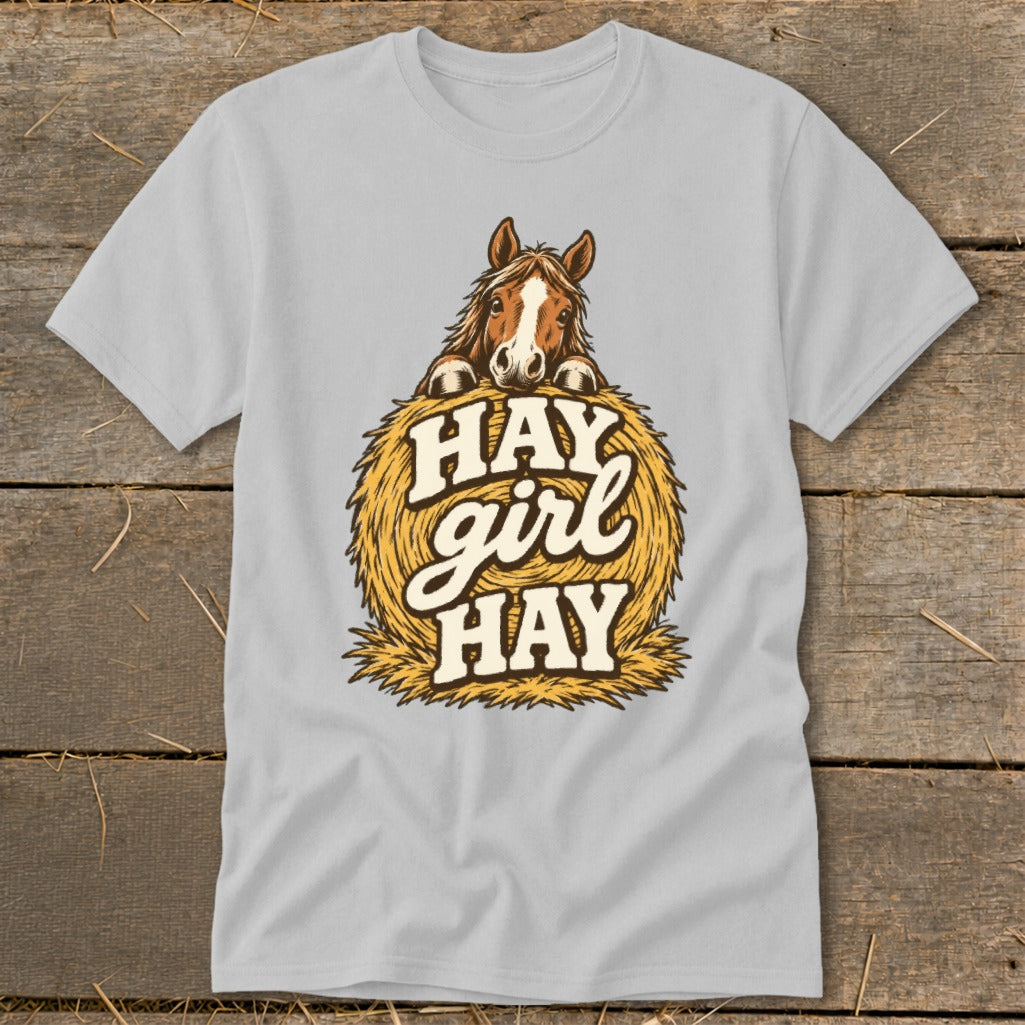 Horse peeking over hay bale with "Hay girl hay" text.