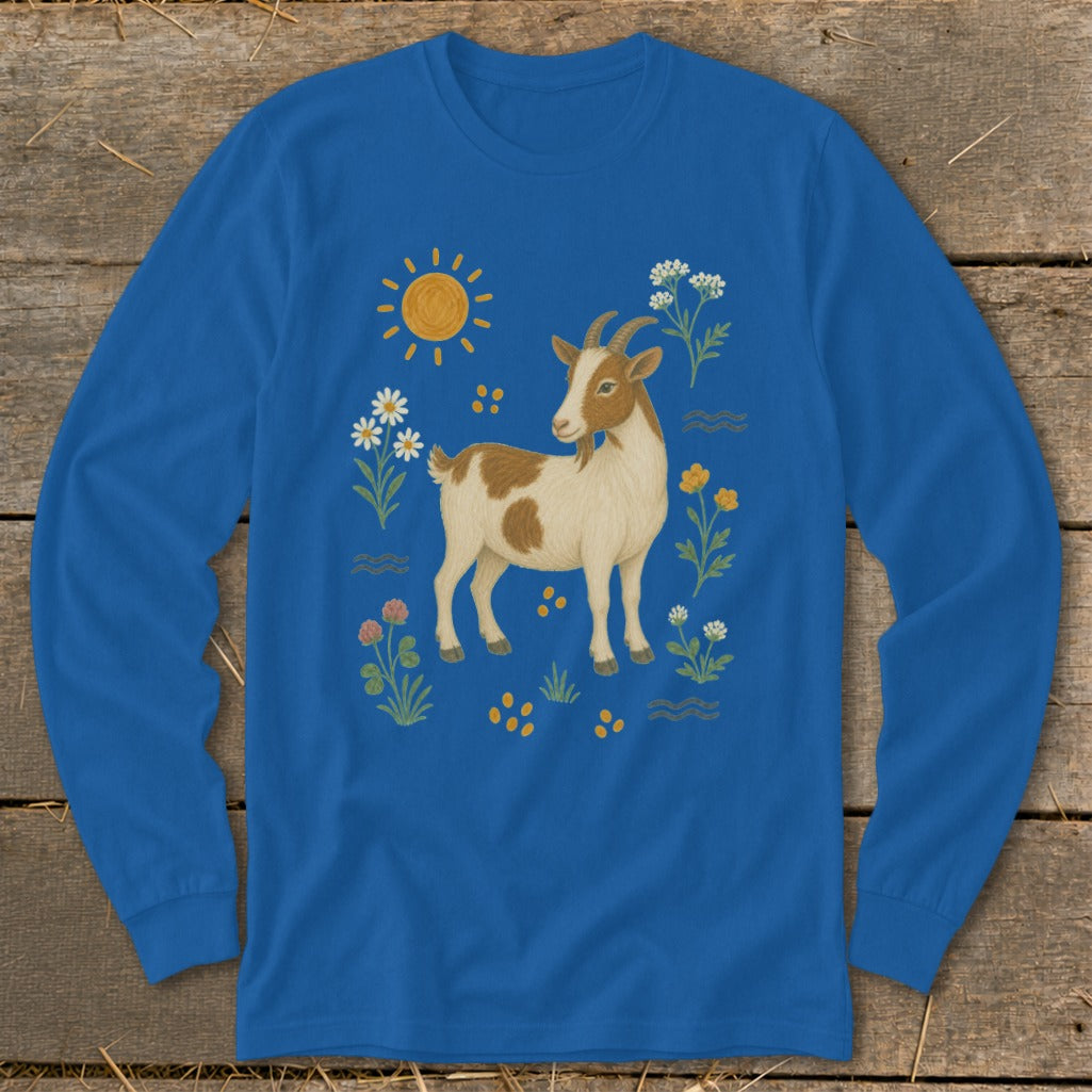 Blue long-sleeve shirt with a brown and white goat illustration surrounded by flowers and a sun.