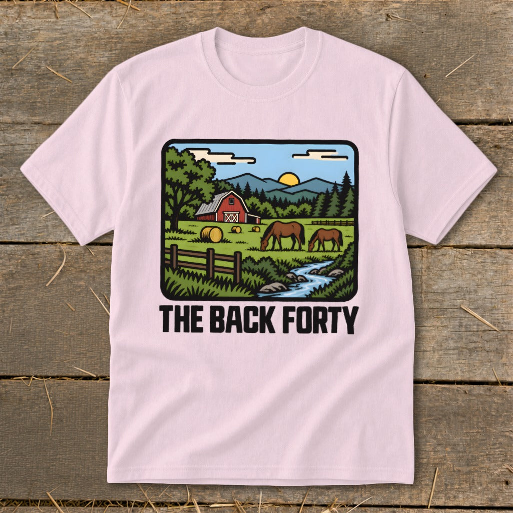 Light pink t-shirt featuring a retro countryside graphic with horses, a barn, and the text The Back Forty.