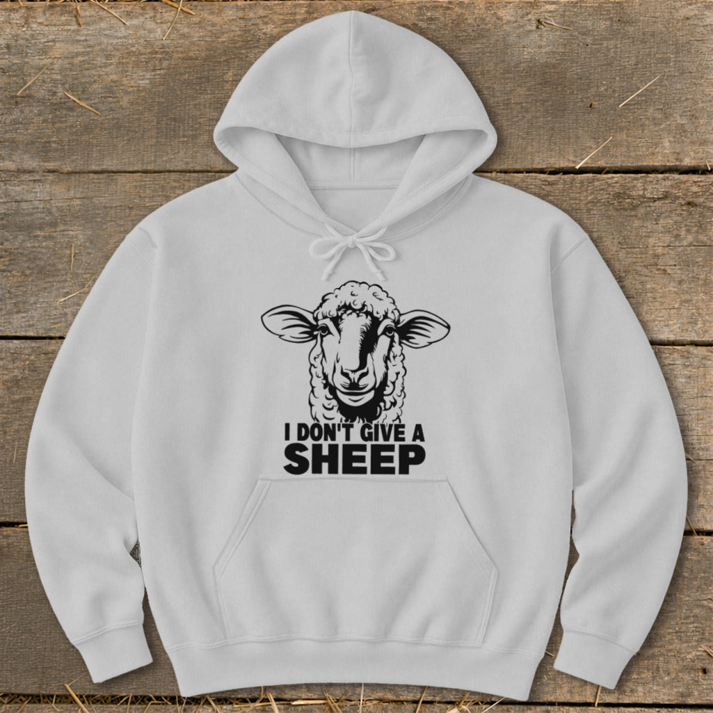 White hoodie with a black graphic of a sheep and the text "I DON'T GIVE A SHEEP".