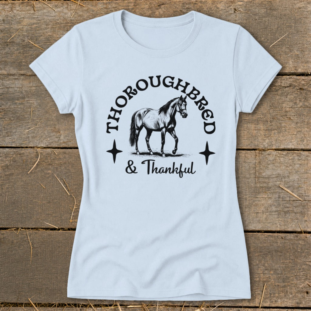Light blue t-shirt with "Thoroughbred & Thankful" text and horse graphic.
