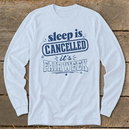 Light blue long-sleeve shirt with blue text reading "sleep is CANCELLED it's FAIR WEEK".