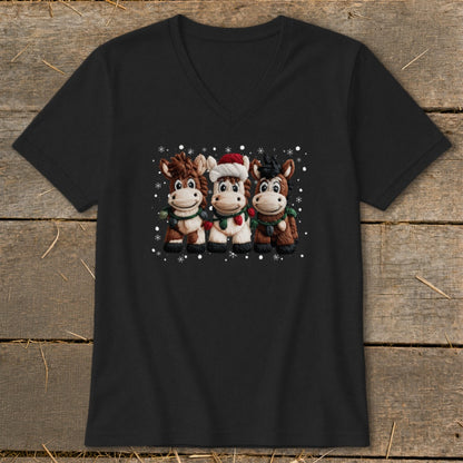 Three cartoon horses wearing holiday scarves and one in a Santa hat with snowflakes.