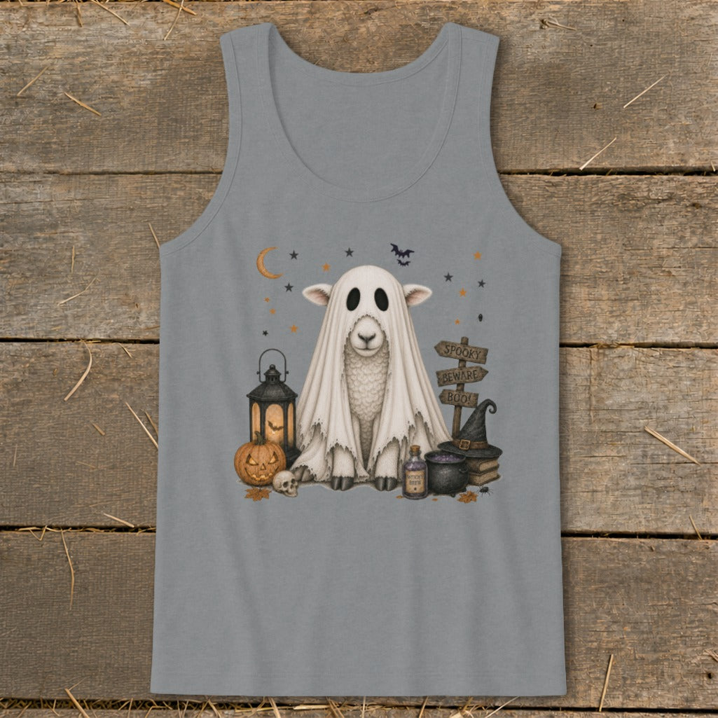 Sheep dressed as a ghost with Halloween decorations including a pumpkin and lantern.