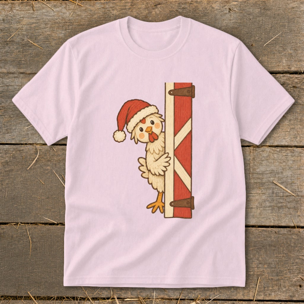 Chick wearing Santa hat peeking from behind a red barn door.