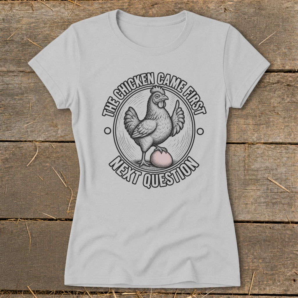 Light grey t-shirt with "The chicken came first, next question" graphic.