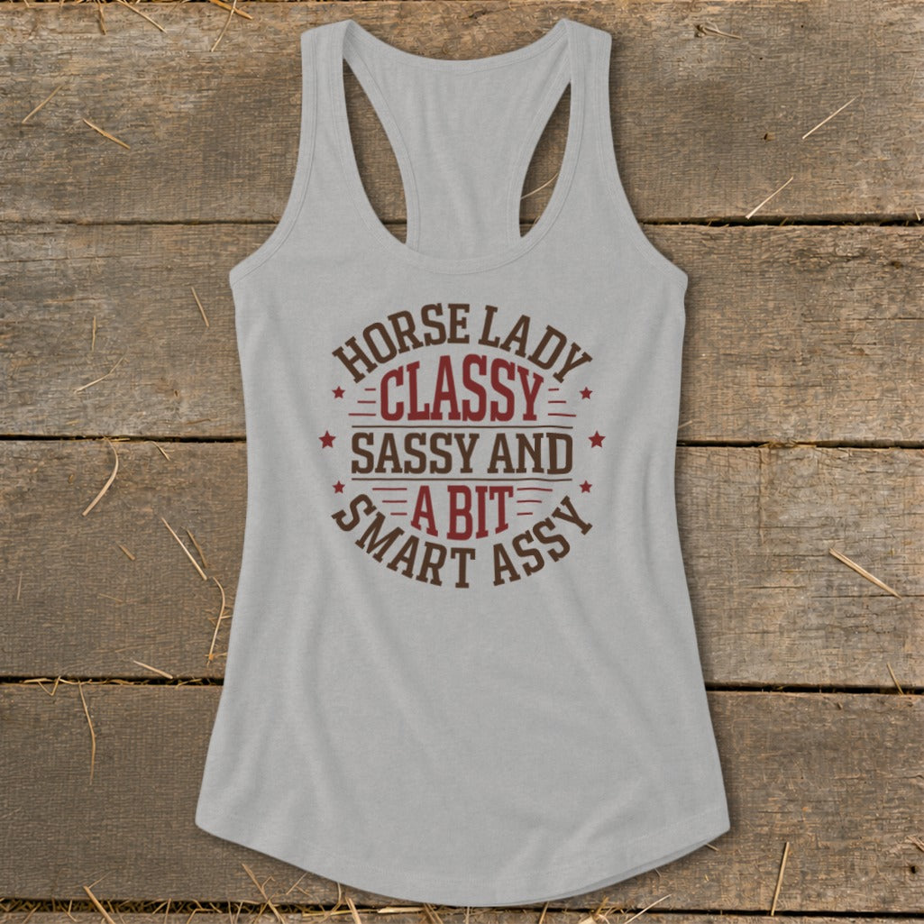 Light gray racerback tank top with "Horse Lady Classy Sassy and a Bit Smart Assy" graphic.