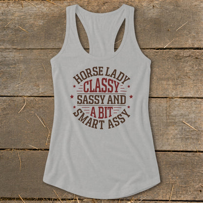 Light gray racerback tank top with "Horse Lady Classy Sassy and a Bit Smart Assy" graphic.