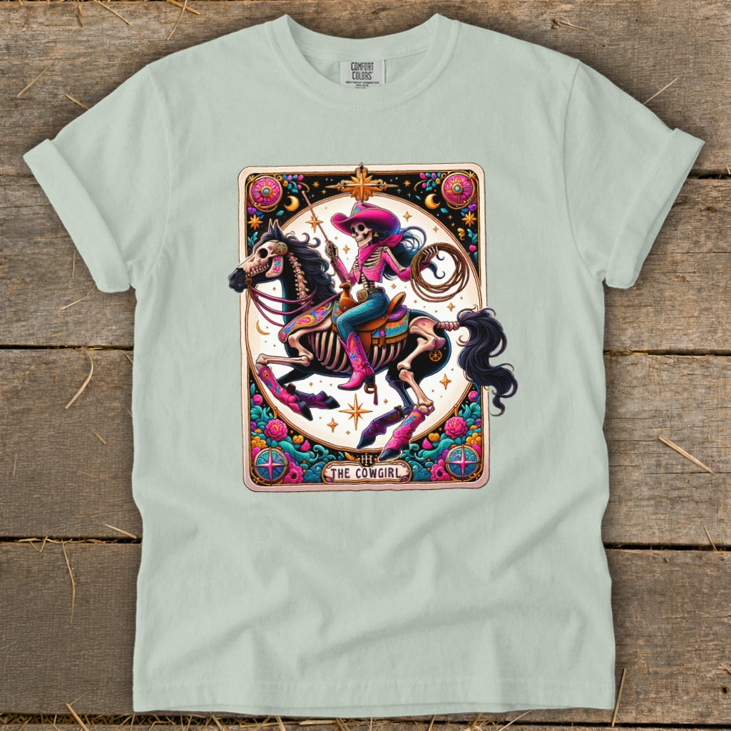 Skeleton cowgirl on horseback tarot card design with text "The Cowgirl".