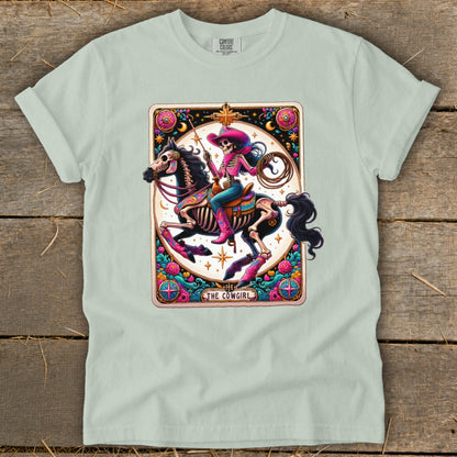 Skeleton cowgirl on horseback tarot card design with text "The Cowgirl".