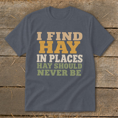 Dark grey t-shirt with text: I FIND HAY IN PLACES HAY SHOULD NEVER BE.