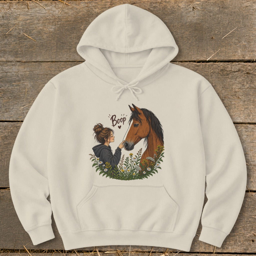Girl booping a horse's nose with flowers and text "Boop"