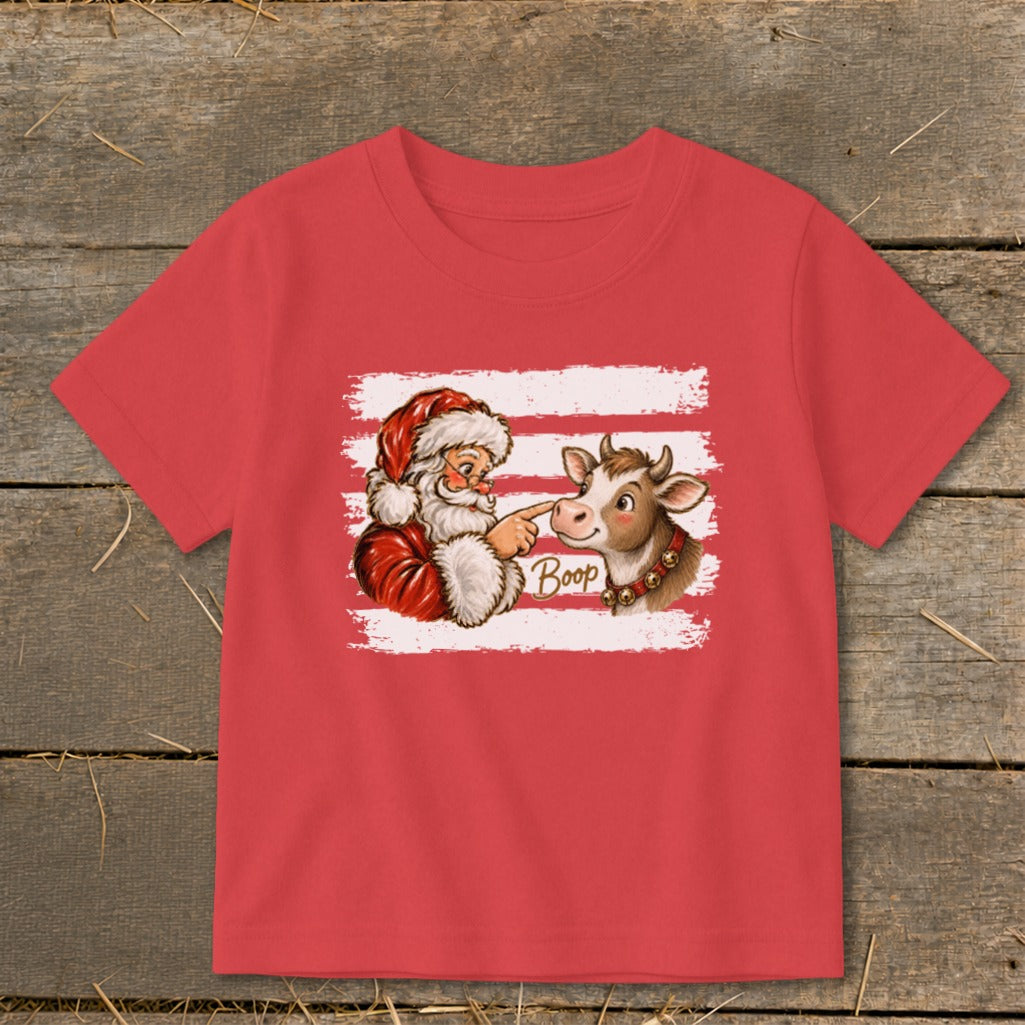 Santa booping a cow with "Boop" text on a red t-shirt.