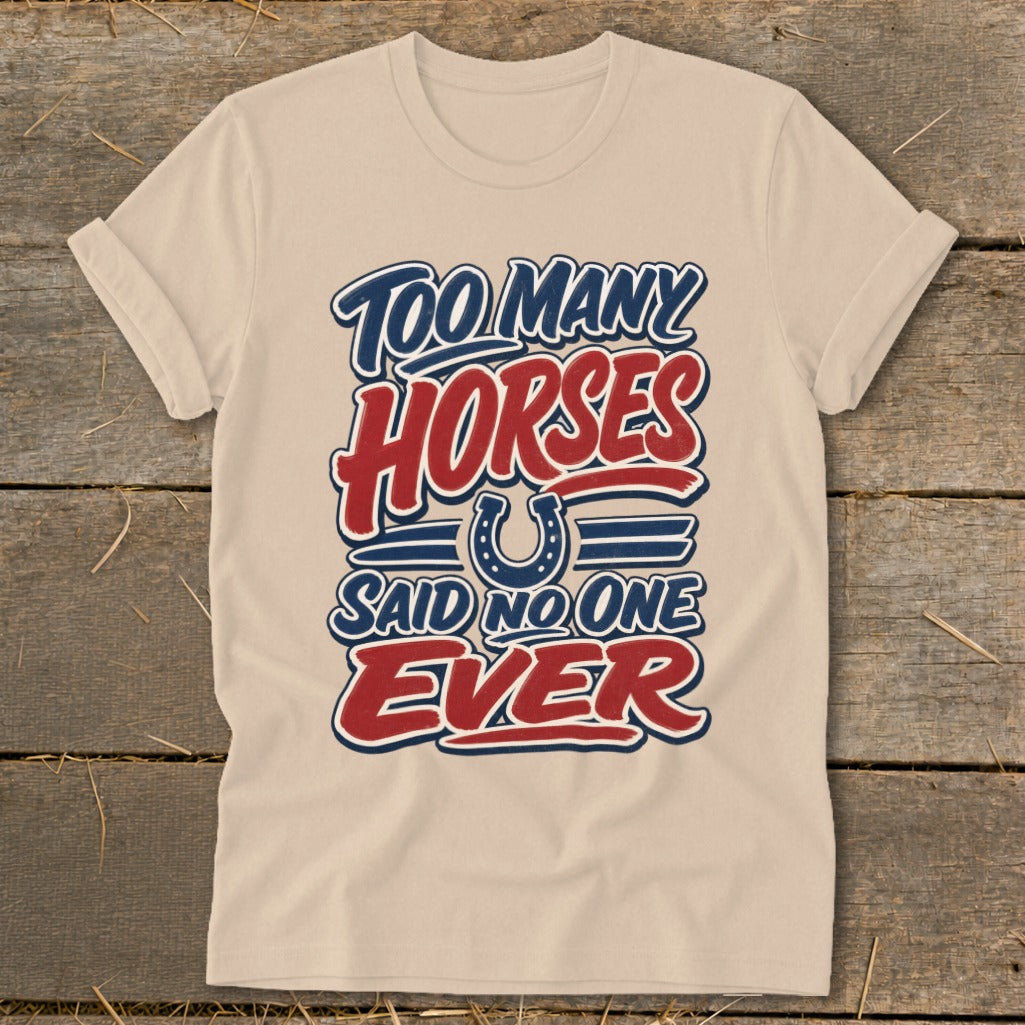 Cream t-shirt with "Too Many Horses Said No One Ever" text and horseshoe graphic.