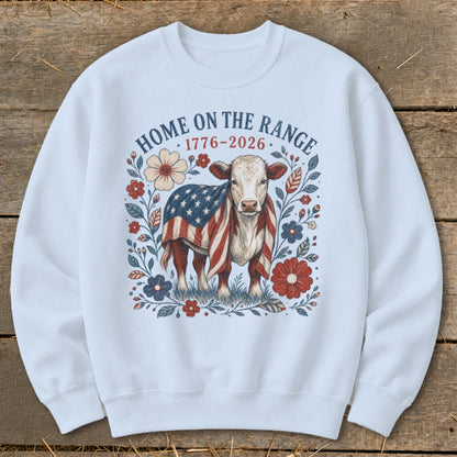 Cow with American flag and flowers, text "HOME ON THE RANGE 1776-2026"