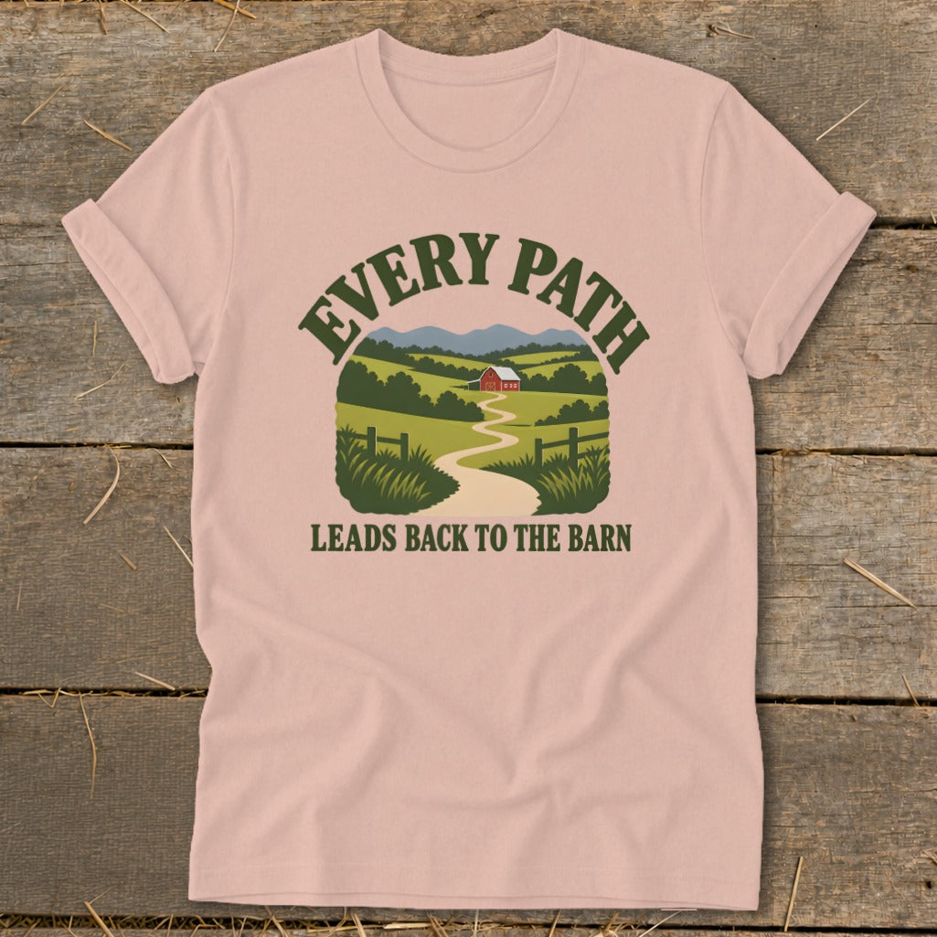 Pink t-shirt with graphic of a winding path leading to a red barn.