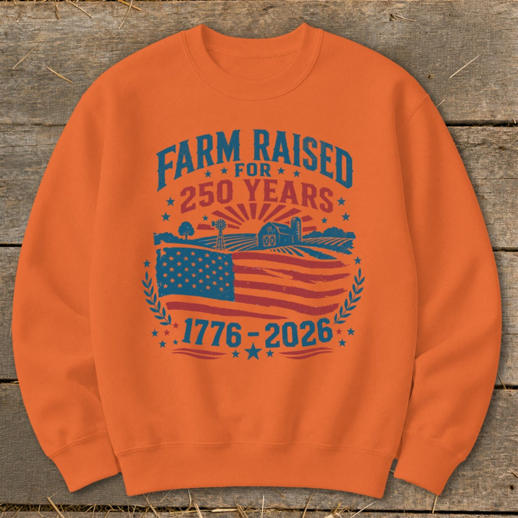 Orange sweatshirt with "Farm Raised for 250 Years" and US flag graphic.