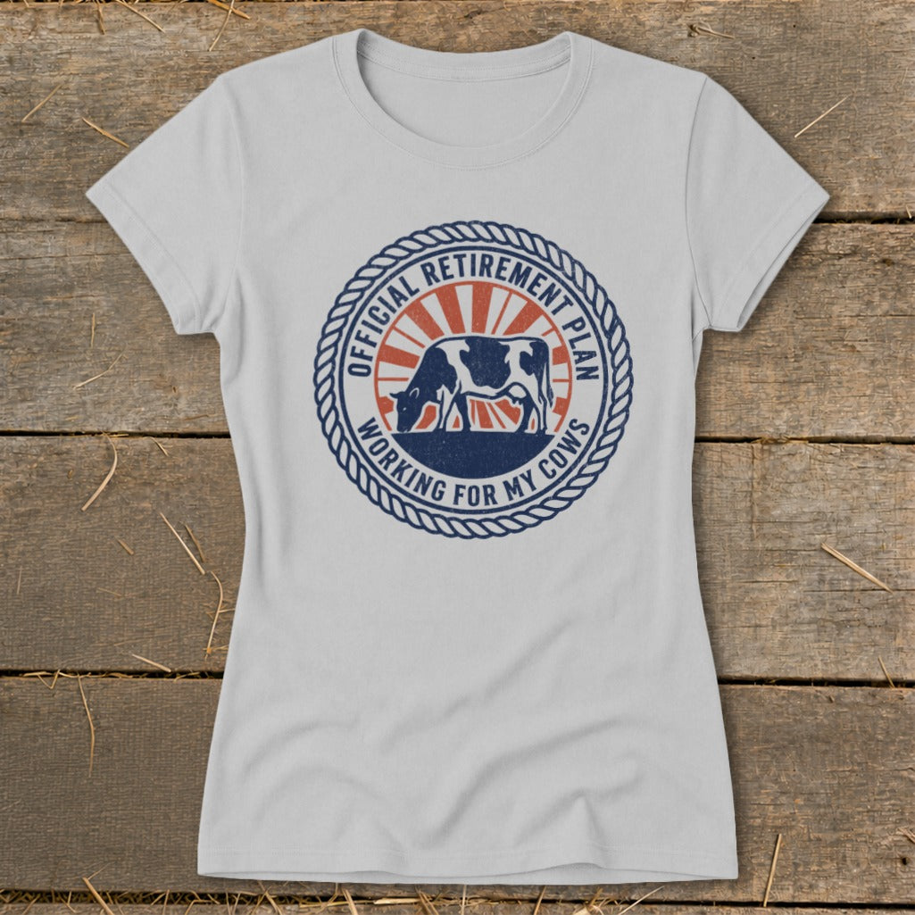 White t-shirt with circular graphic: "Official Retirement Plan Working For My Cows" and cow.