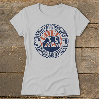 White t-shirt with circular graphic: "Official Retirement Plan Working For My Cows" and cow.