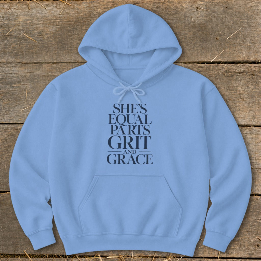 Light blue hoodie with "She's Equal Parts Grit and Grace" text graphic.