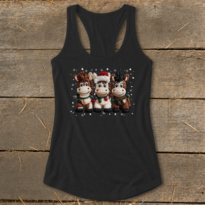 Three cartoon horses wearing Christmas scarves and snowflakes on a black tank top.