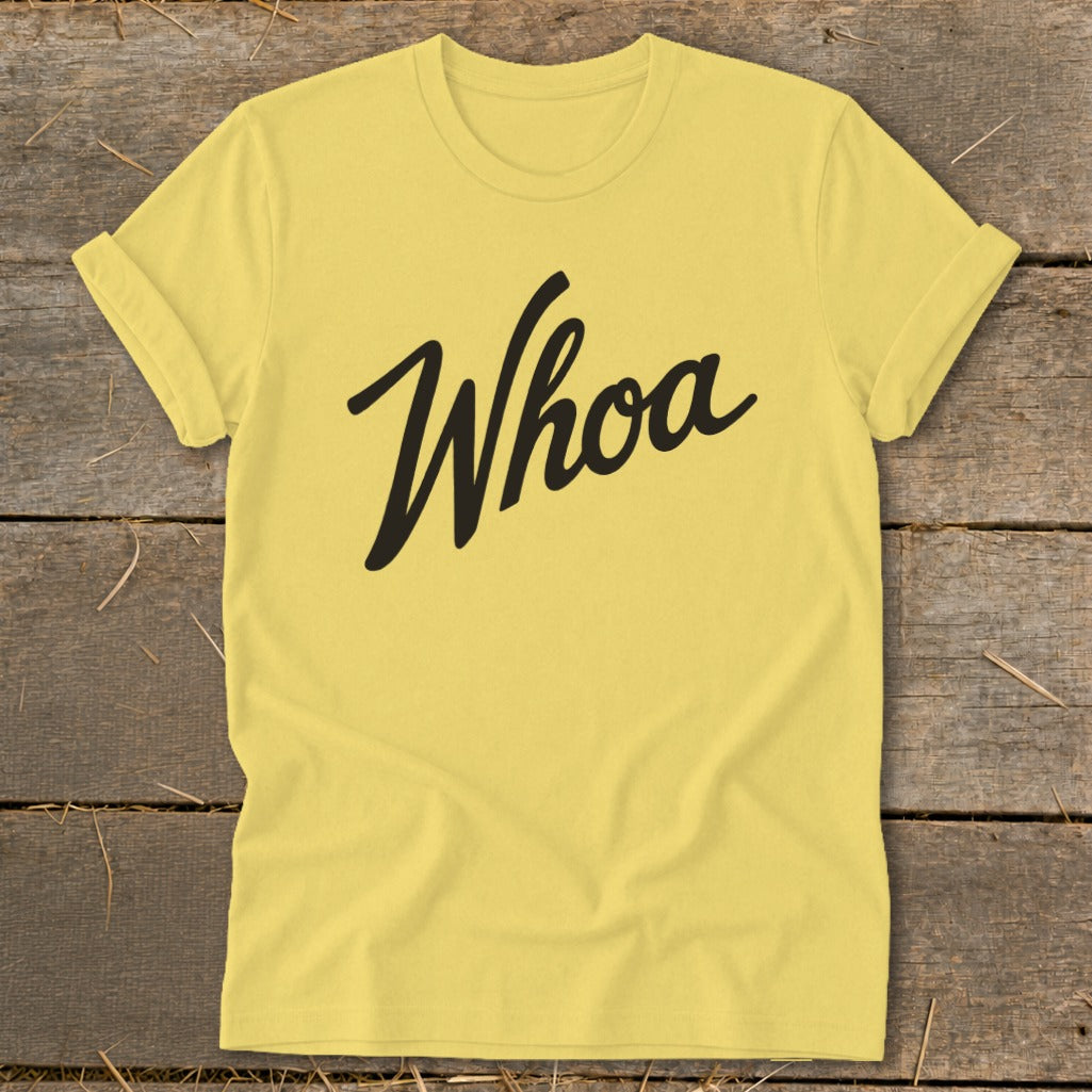 Yellow t-shirt with black cursive text that says "Whoa"