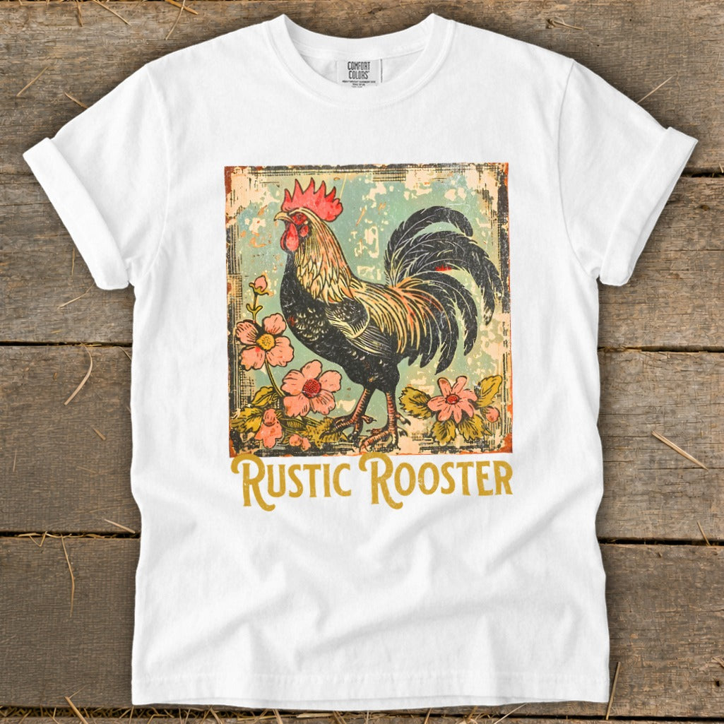 White t-shirt with a vintage rooster and floral graphic that reads "RUSTIC ROOSTER".
