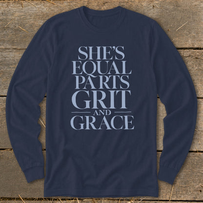 Navy long sleeve shirt with text: She's Equal Parts Grit and Grace.