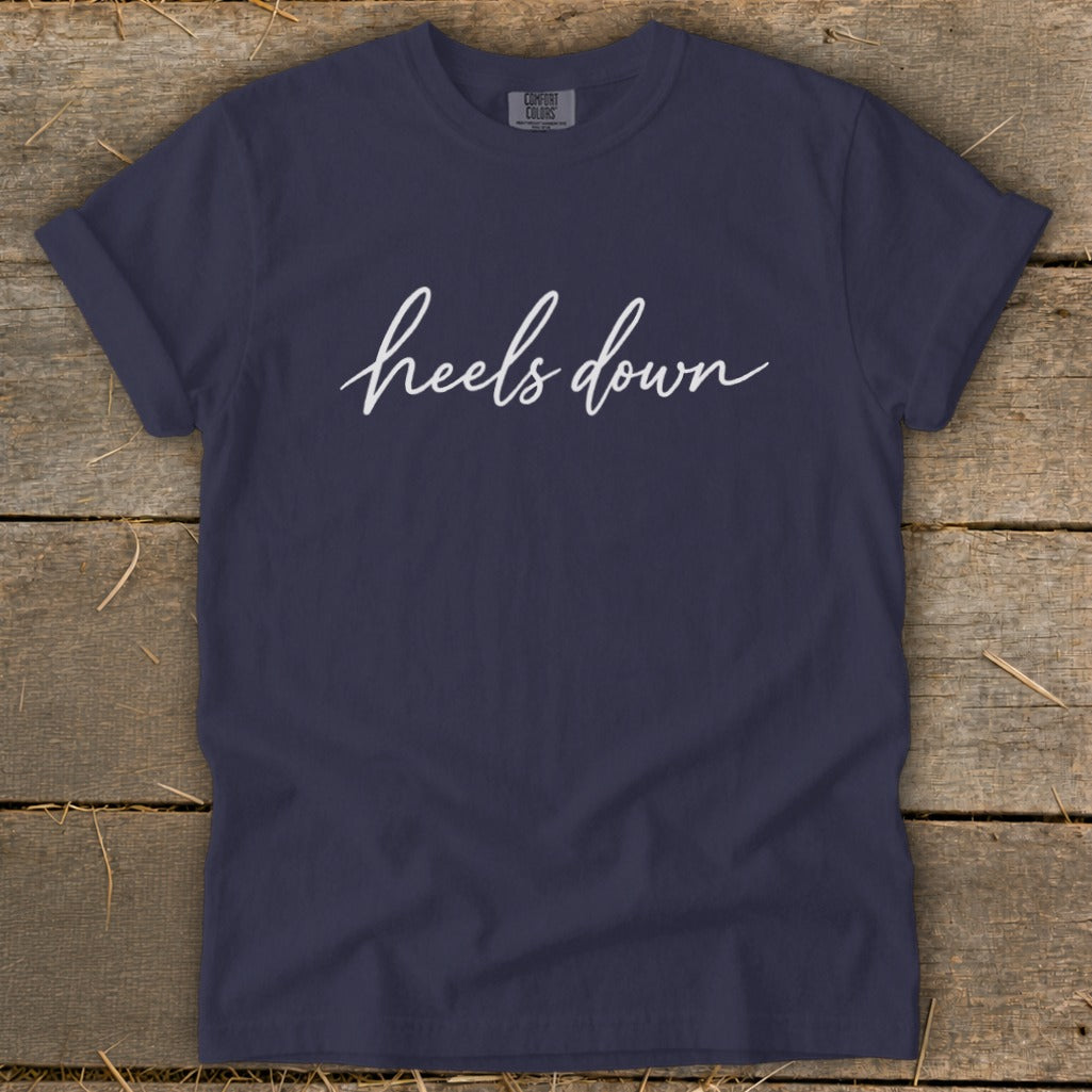 Navy Comfort Colors t-shirt with "heels down" in white cursive text.
