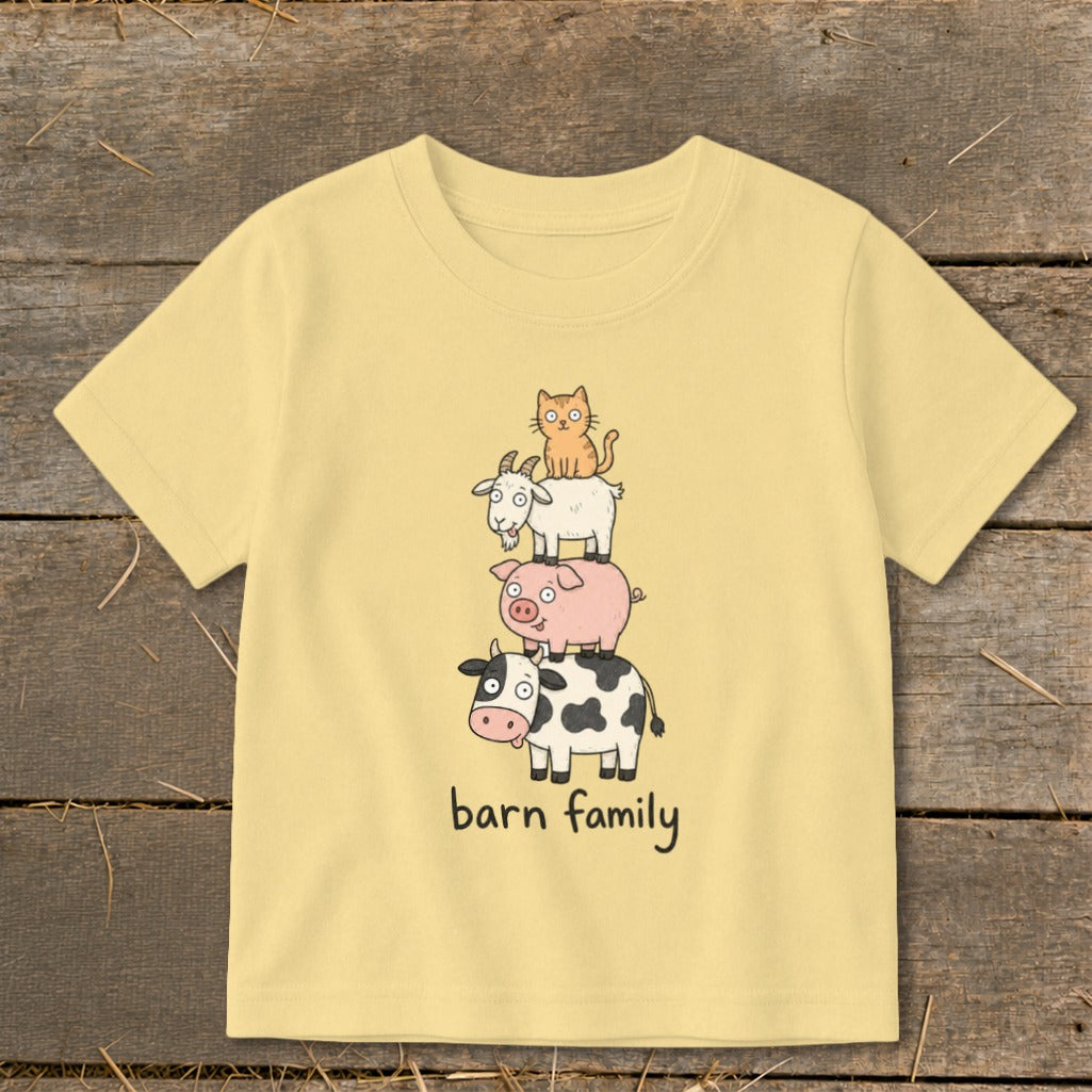 Yellow t-shirt with cartoon barn animals stacked and text "barn family".