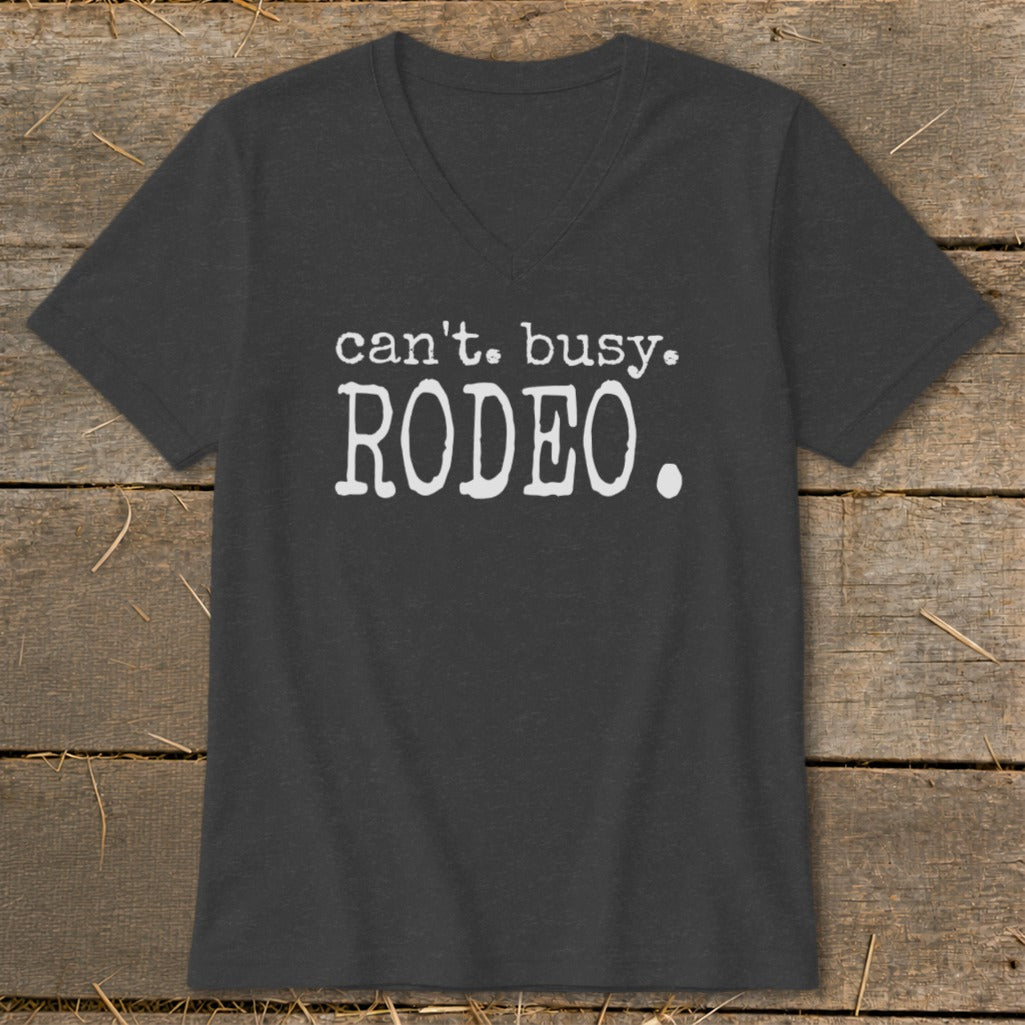 Dark grey v-neck t-shirt with white text that reads "can't. busy. RODEO.".