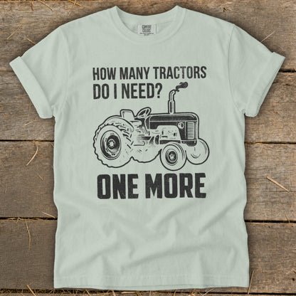 Light blue t-shirt with black graphic: "How Many Tractors Do I Need? One More" and a tractor.