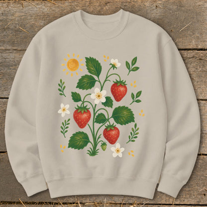 Light tan sweatshirt with a botanical illustration of strawberries, flowers, and a sun.