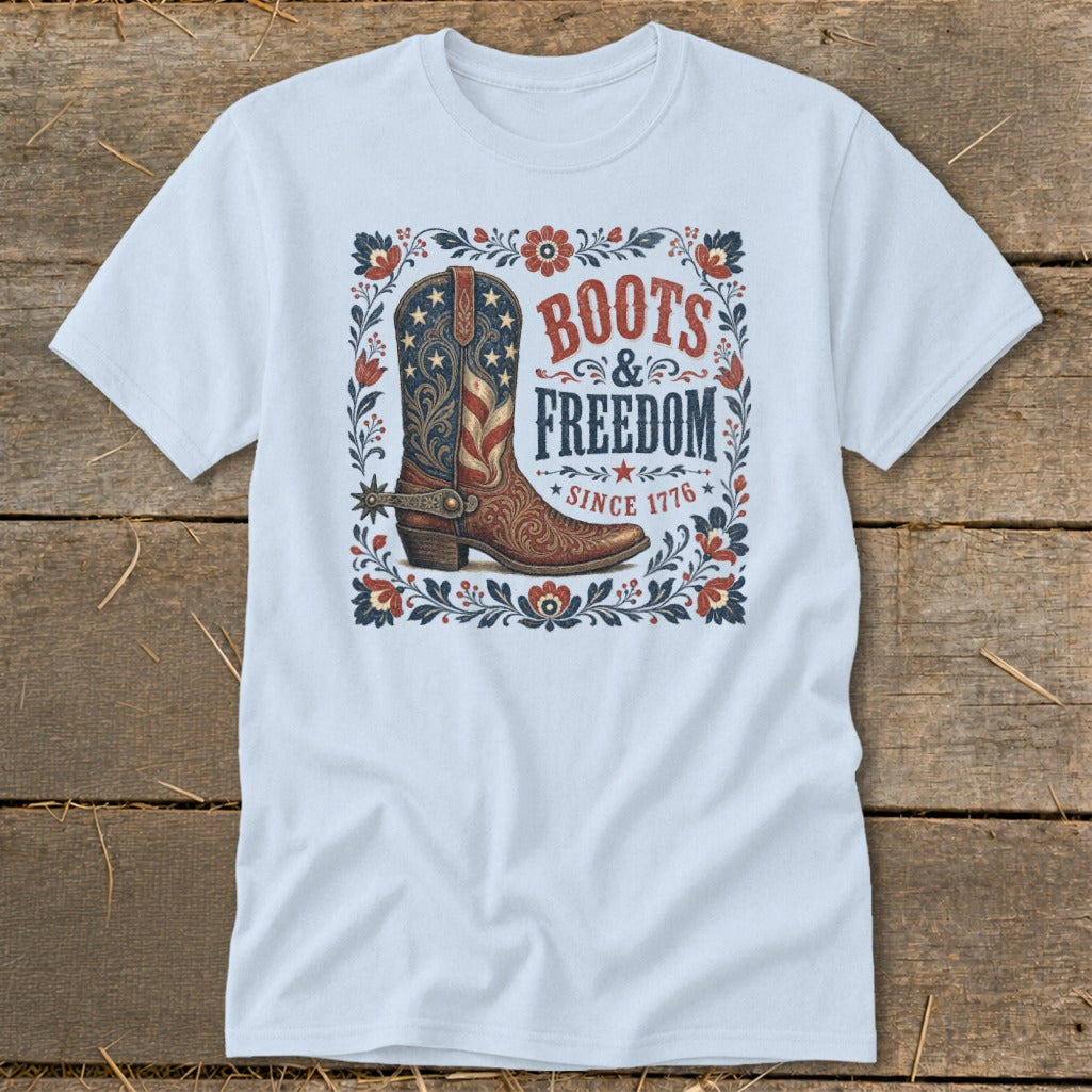 Light blue t-shirt with a patriotic boot design and text "Boots & Freedom Since 1776".