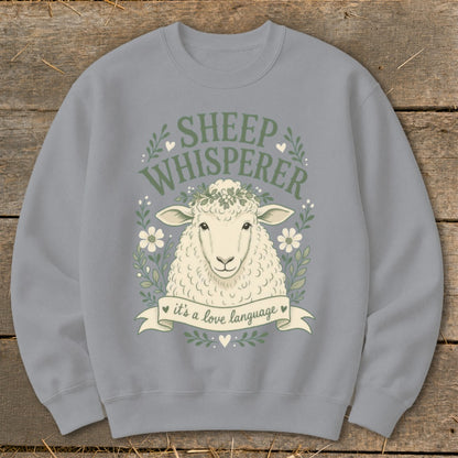 Gray sweatshirt with sheep illustration and text "Sheep Whisperer, it's a love language".