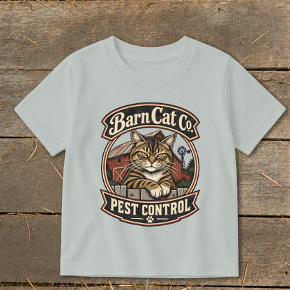Light gray t-shirt with a vintage Barn Cat Co Pest Control graphic on a wooden background.