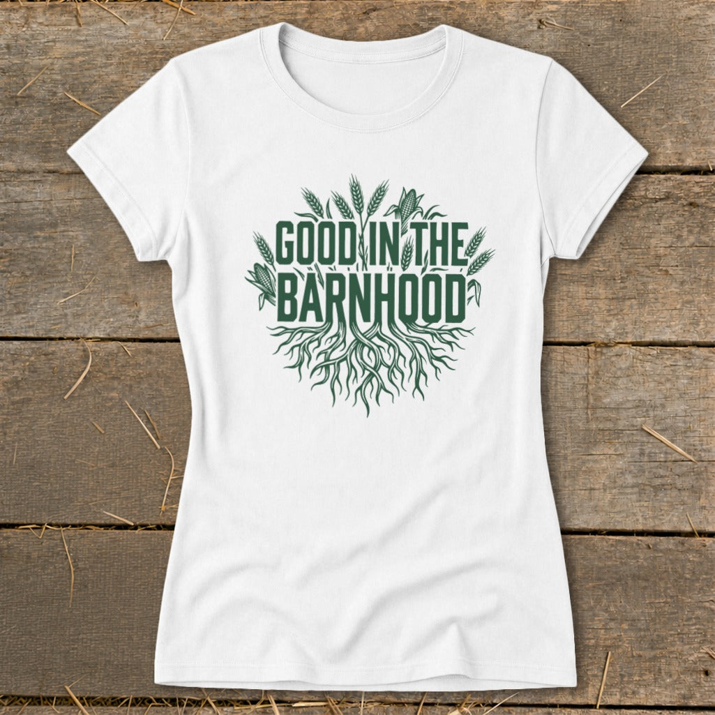 White t-shirt with green "Good in the Barnhood" text and roots design.