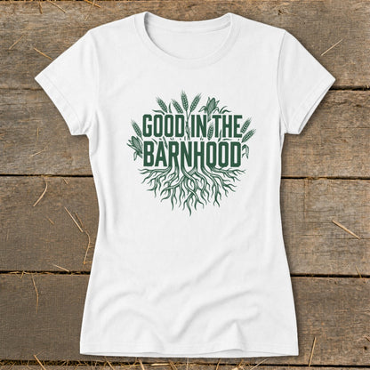 White t-shirt with green "Good in the Barnhood" text and roots design.