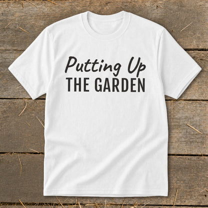 White t-shirt with "Putting Up THE GARDEN" text in black.