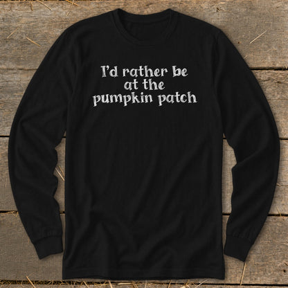 Black long-sleeve shirt with white text "I'd rather be at the pumpkin patch".