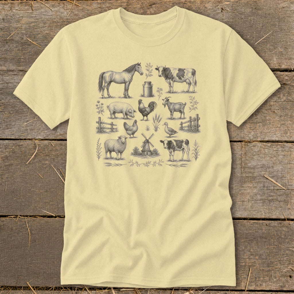 Pale yellow t-shirt with detailed farm animal illustrations: horse, cow, pig, rooster, goat, sheep, chicken, duck, and windmill.
