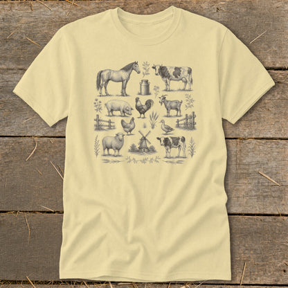 Pale yellow t-shirt with detailed farm animal illustrations: horse, cow, pig, rooster, goat, sheep, chicken, duck, and windmill.