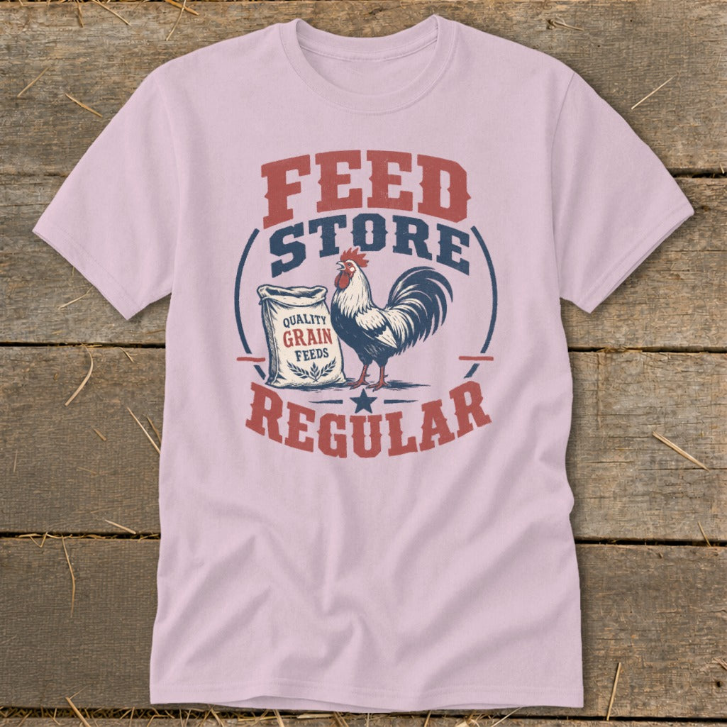 Pink t-shirt with "Feed Store Regular" text, rooster, and grain feed bag graphic.