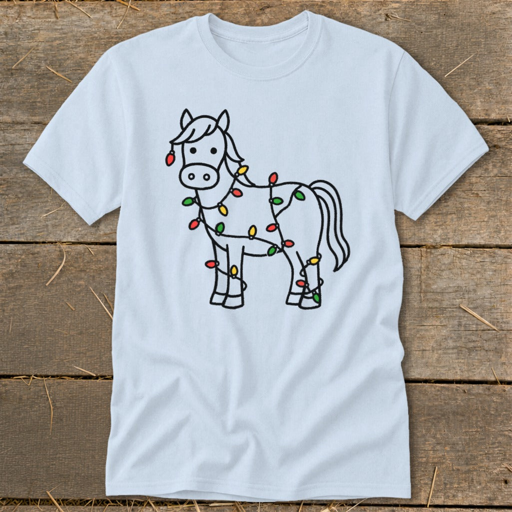 Light blue t-shirt with a black outline drawing of a horse wrapped in colorful Christmas lights.