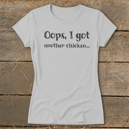 Light grey t-shirt with black text that reads "Oops, I got another chicken..."
