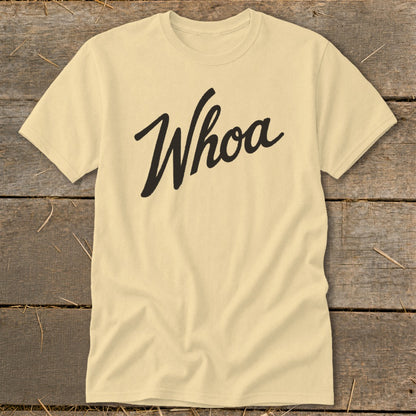 Light yellow t-shirt with black "Whoa" text in a script font.