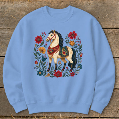 Light blue sweatshirt with a cream horse and floral folk art design.