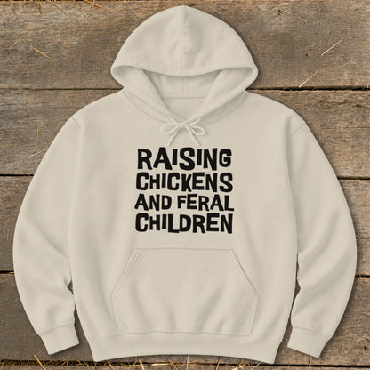 Cream hoodie with black text "RAISING CHICKENS AND FERAL CHILDREN".