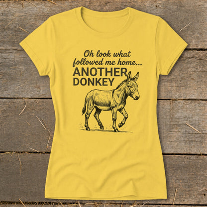 Yellow t-shirt with sketch of donkey and text "Oh look what followed me home... ANOTHER DONKEY".